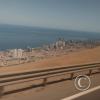Iquique from the highway winding down the giant sand dune