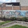Murals, old, at Av Natalia Jarrin and Av Luis Cordero
