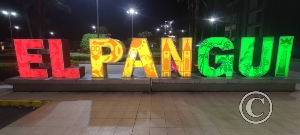 City name sign in Parque La Alborada at night