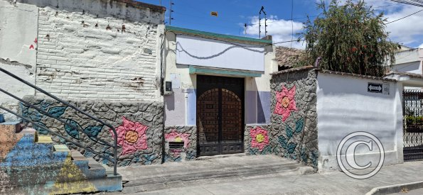 Relief Mural on a house entry at Mariano Suarez Veintimilla