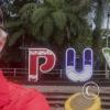 Me in front of the city name sign at the Malecon