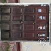 old door showing sticks and adobe blocks construction at Jiron Santa Rosa and Jiron Abancay