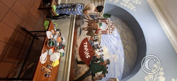 Painting a mural inside Las Tinajas restaurant