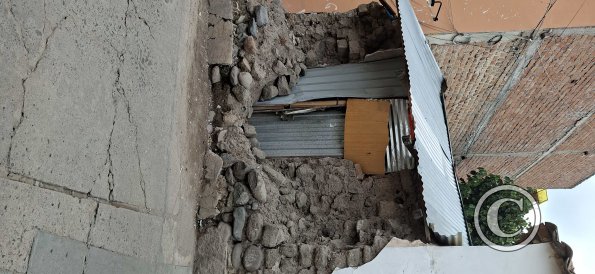 Very old crumbling wall of a house