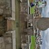 A modern decorative version of the Aztec Sun Stone in front of the Monumento-Tower to Pachacutec