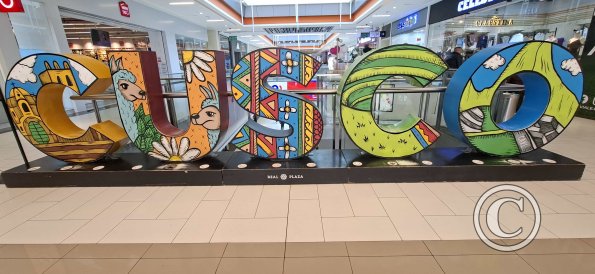 City name sign in the Plaza Vea Mall, second floor