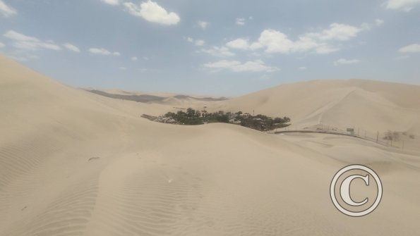 View of Huacachina from a sand dune outside of Huacachina