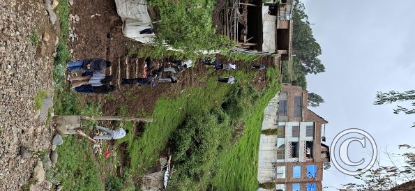 The mud slope wherre the teens are cutting in steps